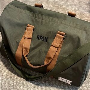 Herschel Green and Tan Duffel Bag